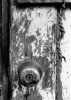 doorknob on peeling door